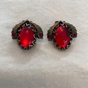 Pair of clip-on earrings. Red stone.